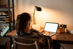 woman sitting at laptop