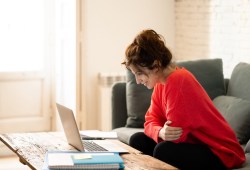 woman smiling at laptop