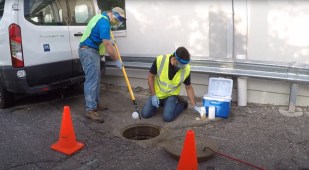 University of Michigan researchers collect wastewater samples to test COVID-19 levels.