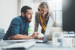 people working at laptop