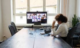 woman on Zoom in conference room