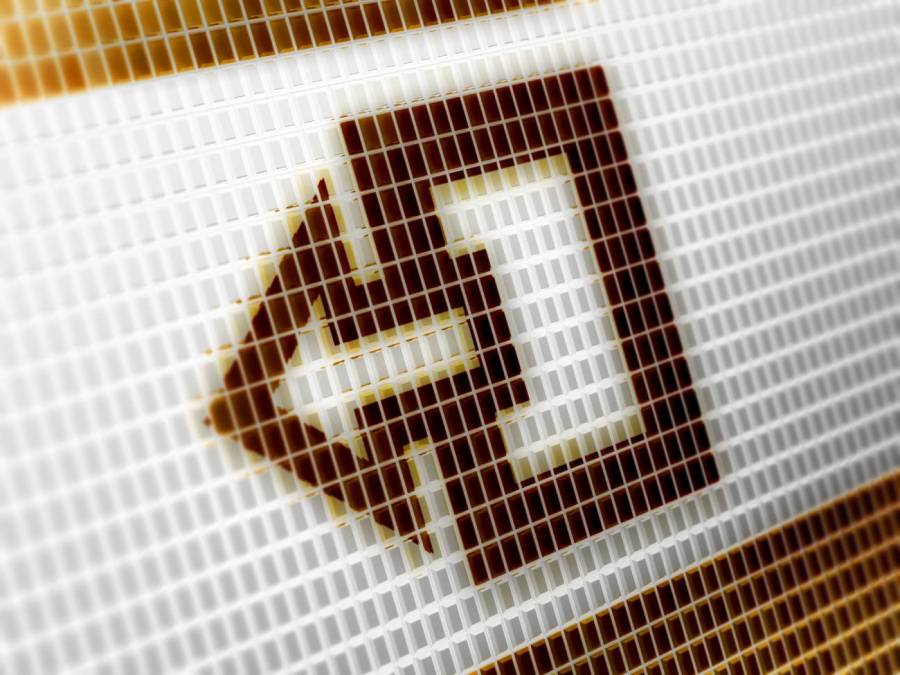 A close up of a pixelated exit icon on a computer screen showing a box with an arrow pointing left.