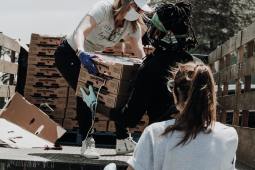 people unloading strawberries